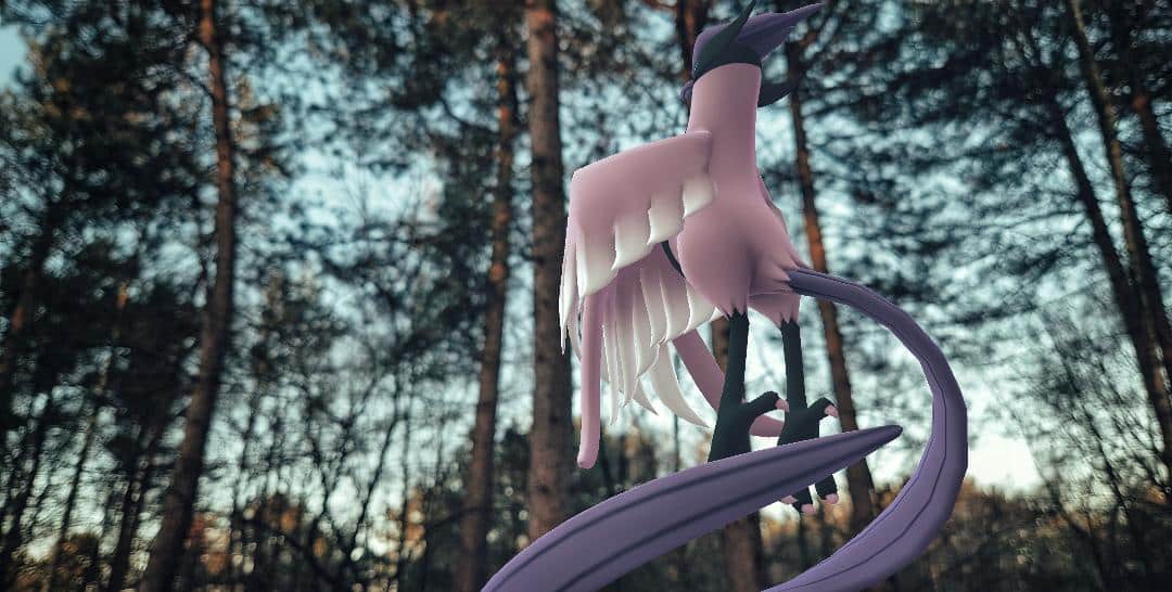 A Galarian Articuno is on the right side of the photograph, looking to the left with their back to the camera. Their wings are folded across in front of them, while their tail swirls below. Behind them is a wooded area, the sky is clear and the sun is starting to set