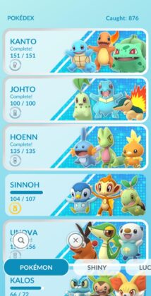New updated Pokémon GO Pokédex. It is light blue, with POKEDEX Caught: 876 at the top. Underneath are three banners for Kanto, Johto, Hoenn, Sinnoh, Unova and Kalos, each show the regions three starter Pokémon jumping happily.