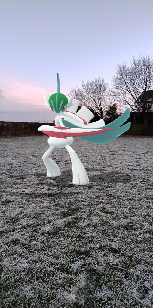 A Mega Gardevoir poses in a frosty field