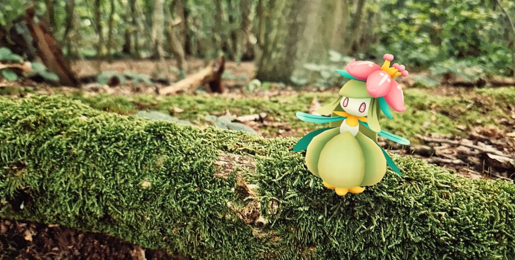 A Lilligant dances on a mossy log