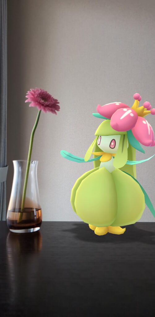 A Lilligant looks at a flower in a vase