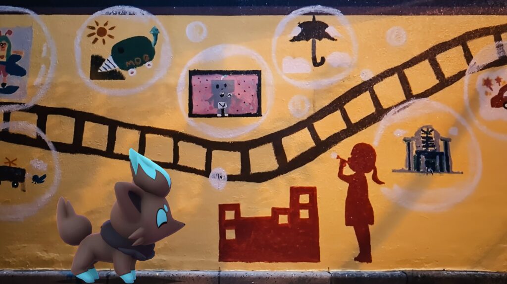 A shiny Zorua looks at graffiti on a wall