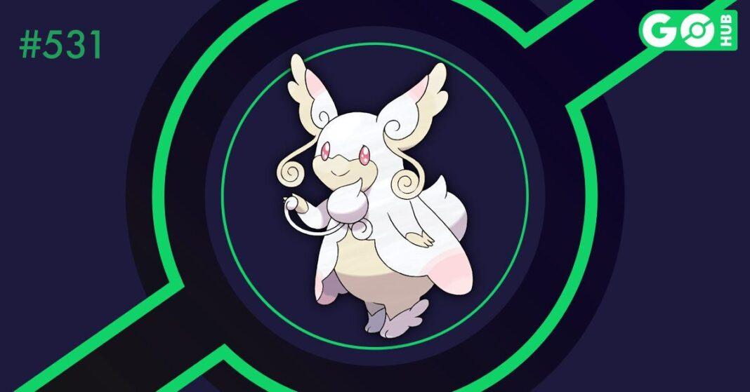 Mega Audino on a dark blue background with green circles surrounding it