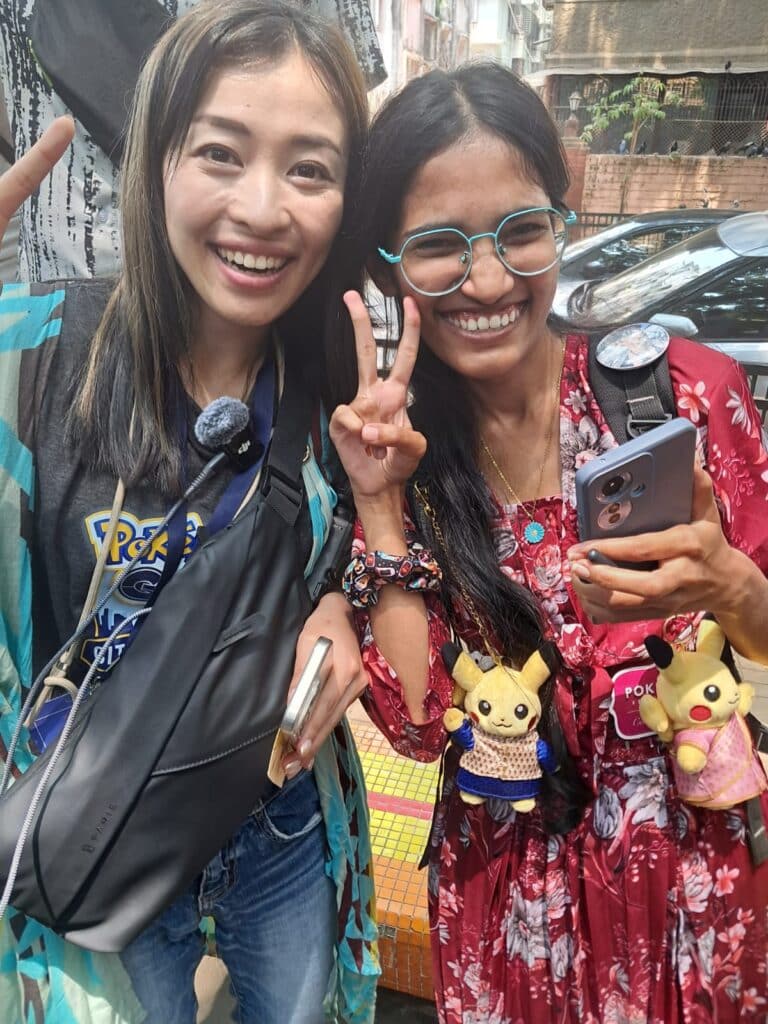 yuri kitayama with a trainer having saree and kurta pikachu plushies