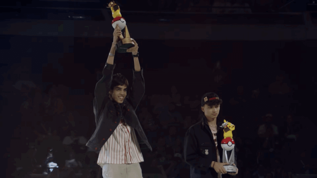 Beelzeboy holding up the 2025 world championship trophy and patoman holding the second place one next to him